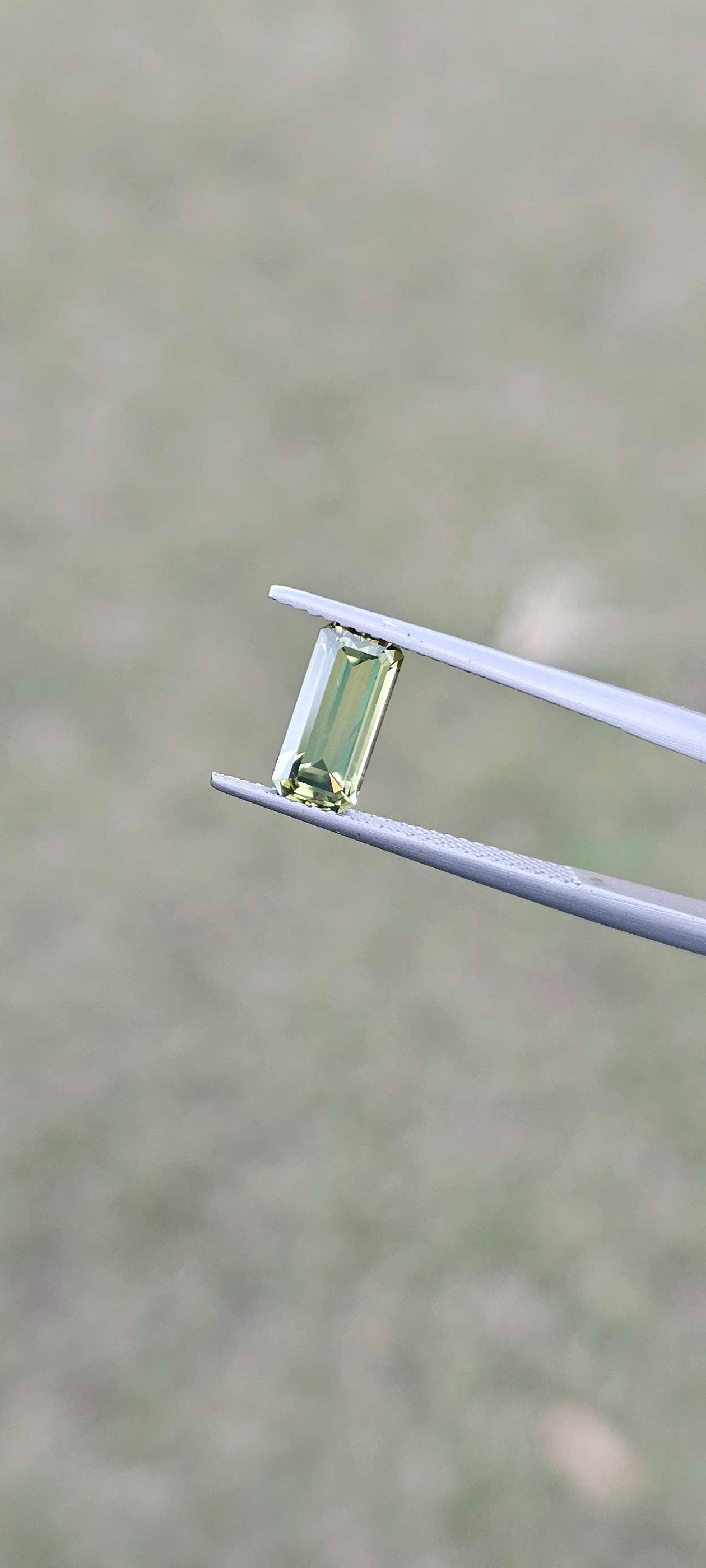 1.960ct pale green emerald cut sapphire - Evolution Gemstones