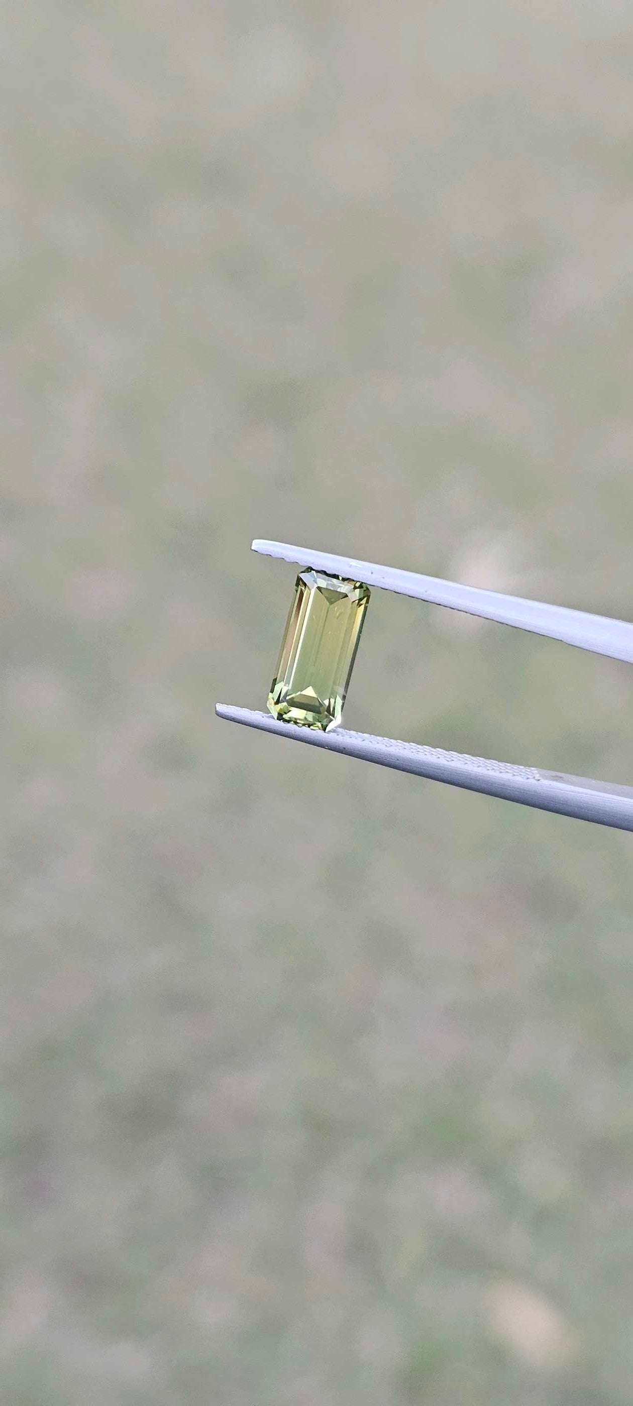 1.960ct pale green emerald cut sapphire - Evolution Gemstones