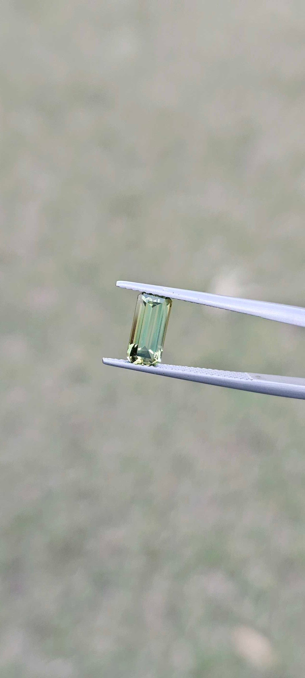1.960ct pale green emerald cut sapphire - Evolution Gemstones