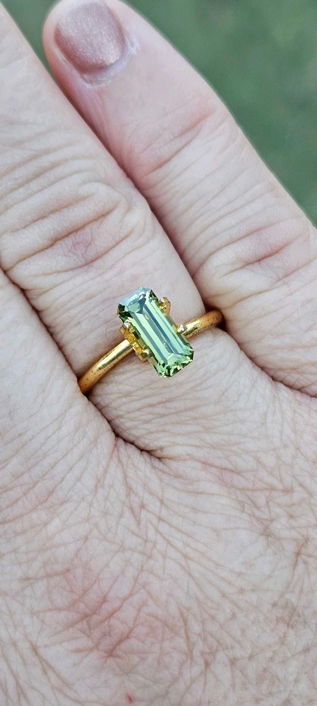 1.960ct pale green emerald cut sapphire - Evolution Gemstones