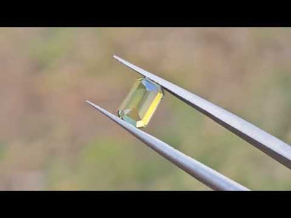 Yellowish emerald cut sapphire